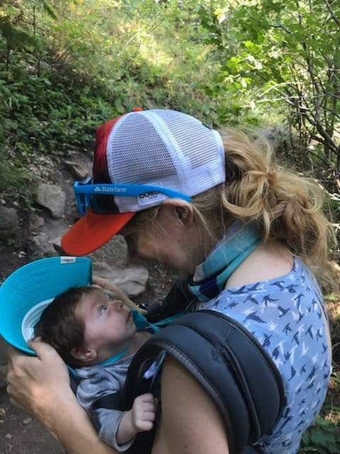 Hiking with baby in carrier.