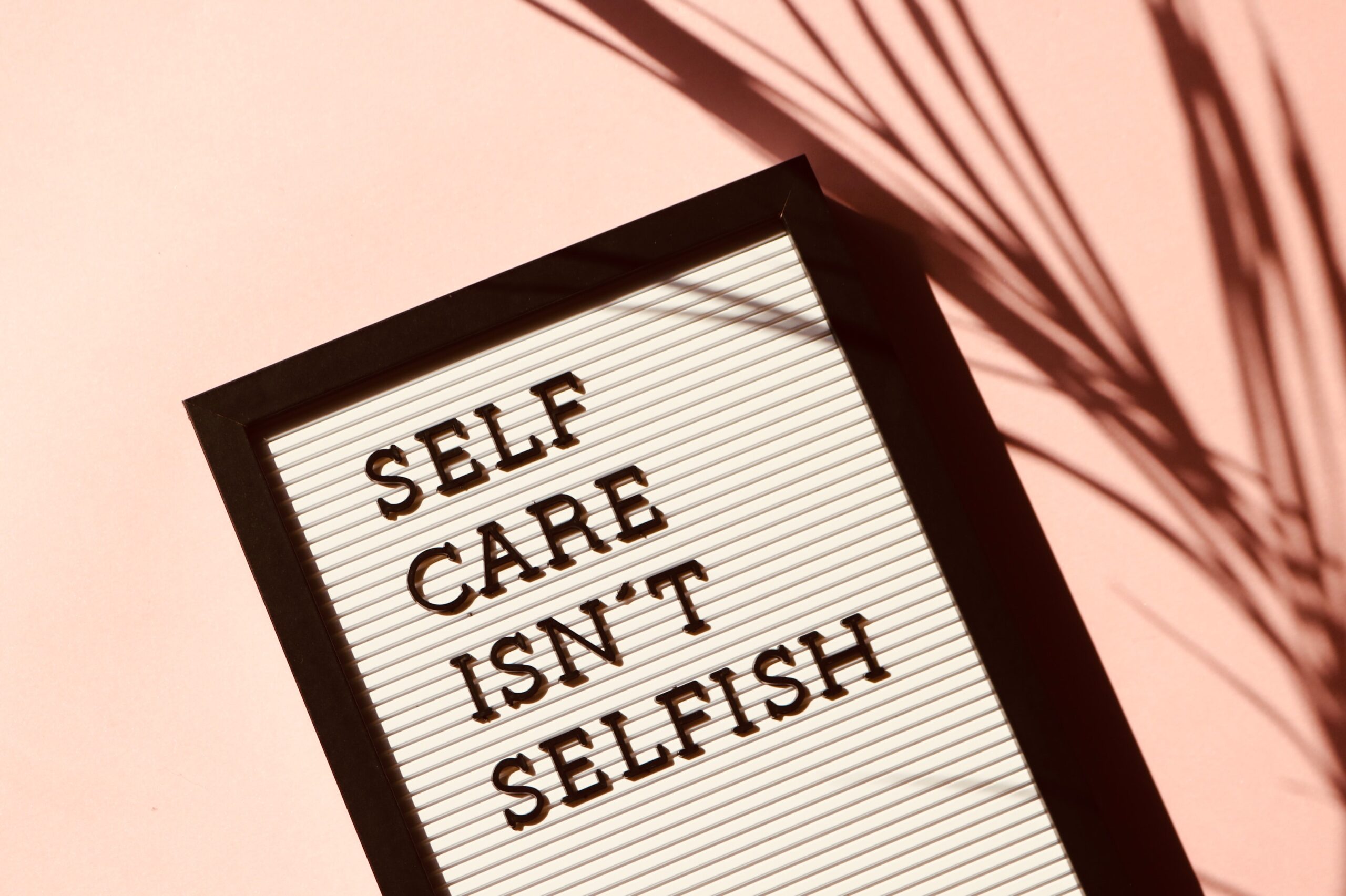 Image of whiteboard "self care isn't selfish"